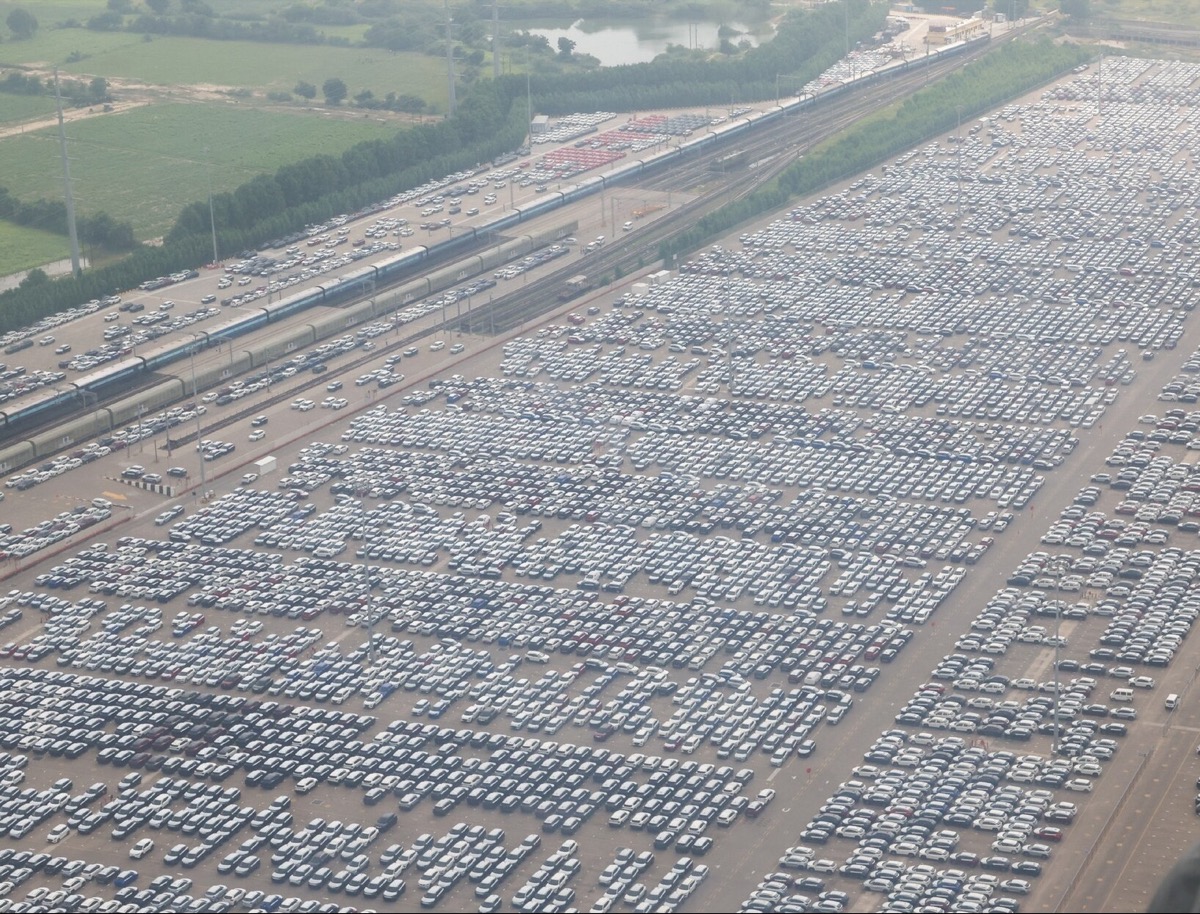 Aerial view of thousands of new vehicles in a plant yard at Hansalpur, Gujarat.